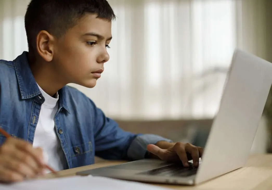 boy working on laptop
