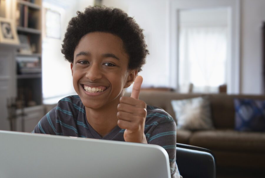 Teenager boy giving thumbs up